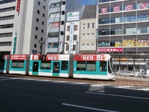 red_ad_tram_outside
